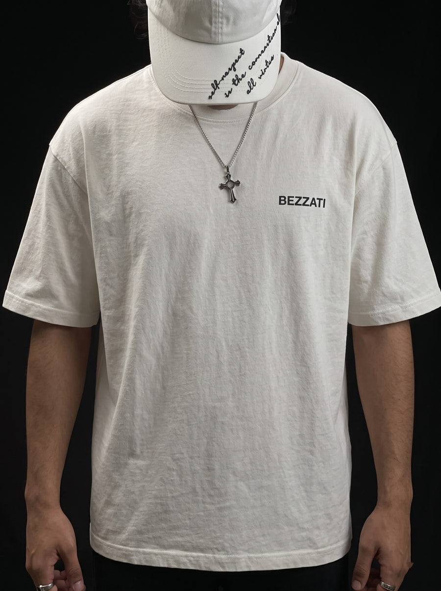 Close view of the white oversized t-shirt and its small Bezzati chest wordmark