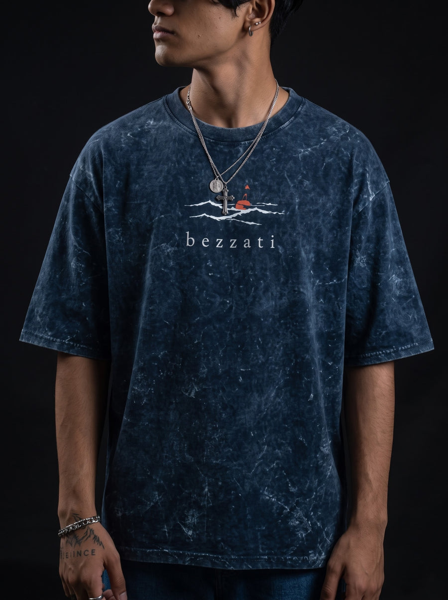 Front of the navy acid-wash Open Waters t-shirt, a small boat and sun mark above the bezzati wordmark