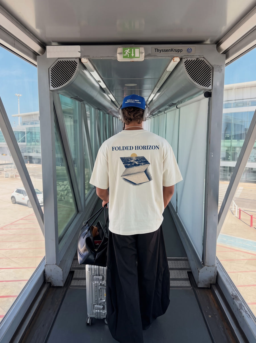 Folded Horizon back print worn walking down an airport jet bridge