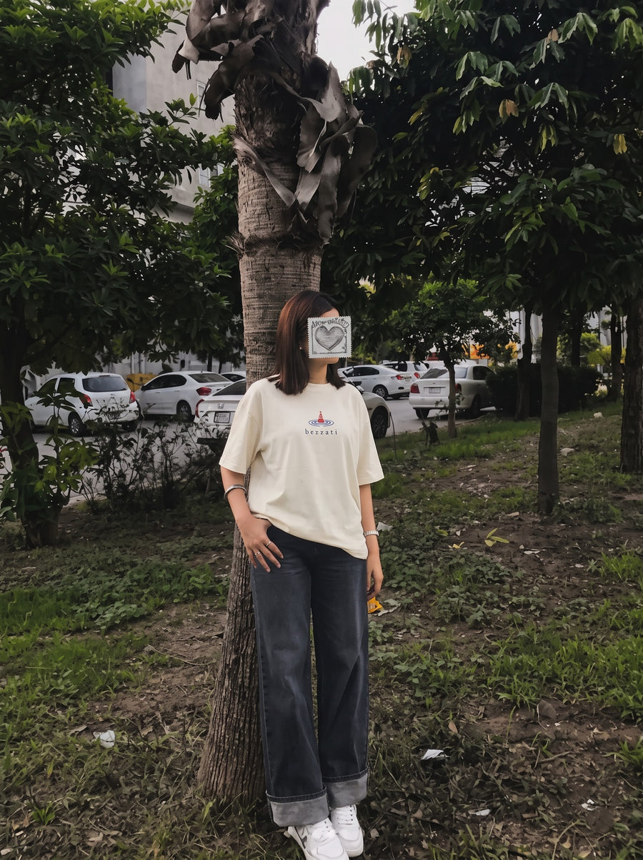 Front of the off-white Tide Archive t-shirt, a small lighthouse mark above the bezzati wordmark