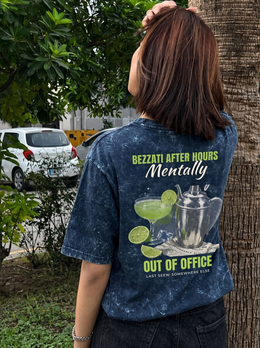Out Of Office back print with a margarita and a cocktail shaker, on a navy acid-wash t-shirt