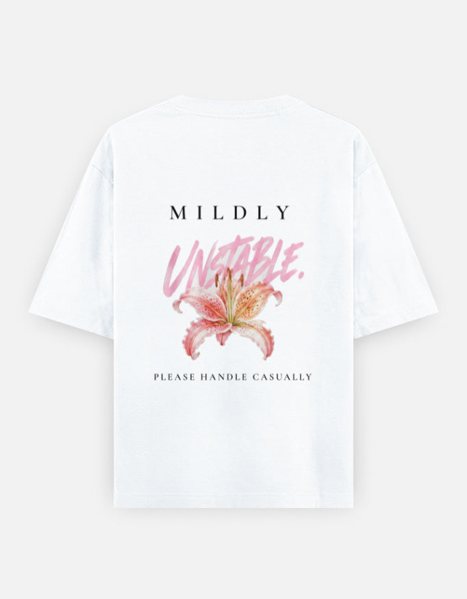 Mildly Unstable back print: letterspaced caps and a pink brush script over a lily, above the words please handle casually