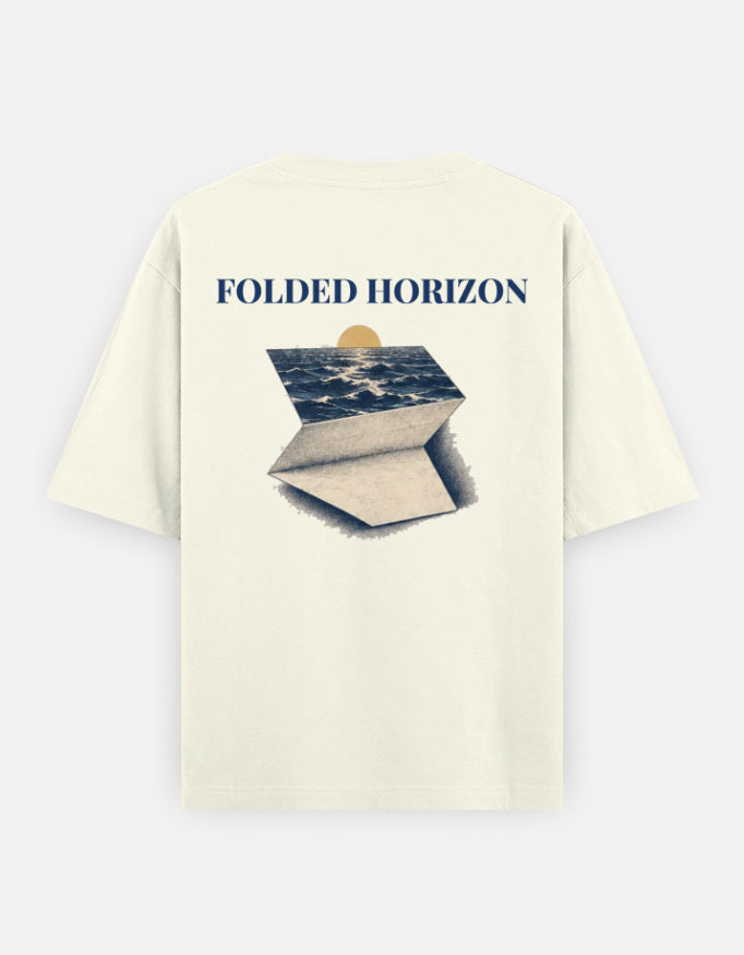 Folded Horizon back print: a sea horizon under a low sun, drawn as a folded sheet of paper, on an off-white oversized t-shirt