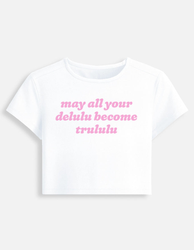 Front of the white Delulu Become Trululu cropped baby tee: may all your delulu become trululu in pink rounded italic