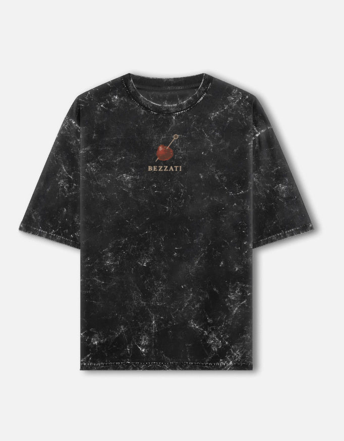 Front of the black acid-wash oversized t-shirt, with a small cherry above the Bezzati wordmark on the chest