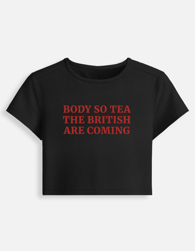 Front of the black British Are Coming cropped baby tee: Body so tea, the British are coming in red serif capitals