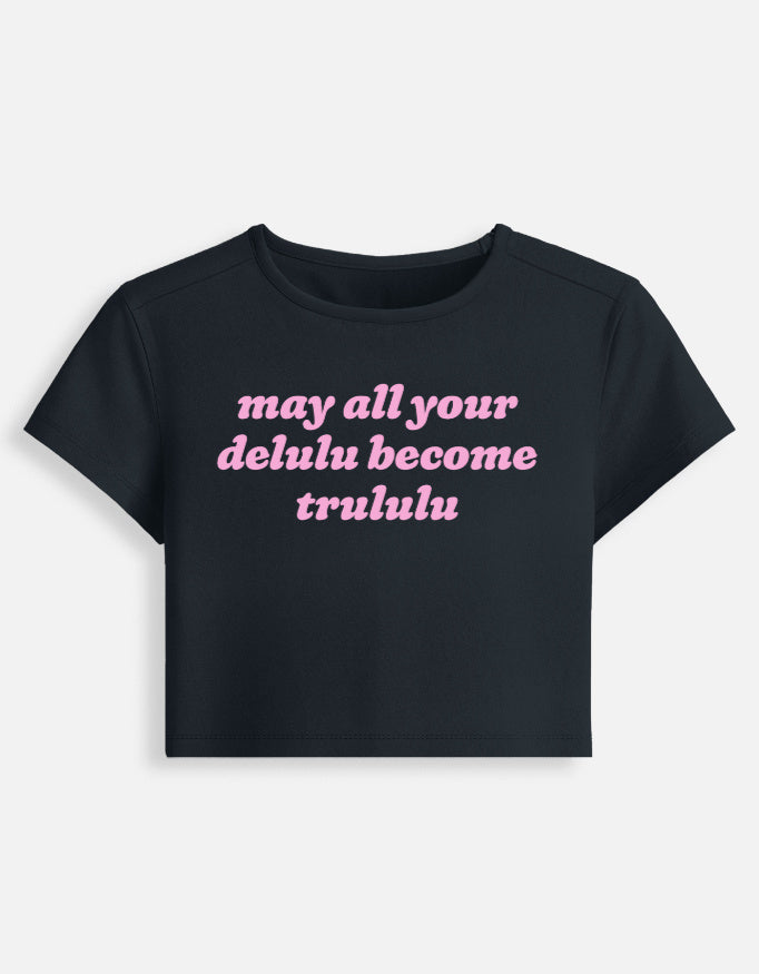 Front of the navy blue Delulu Become Trululu cropped baby tee: may all your delulu become trululu in pink rounded italic