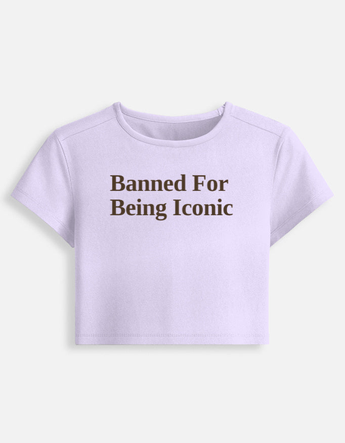 Front of the Banned cropped baby tee in Lavender: Banned For Being Iconic in dark-brown serif