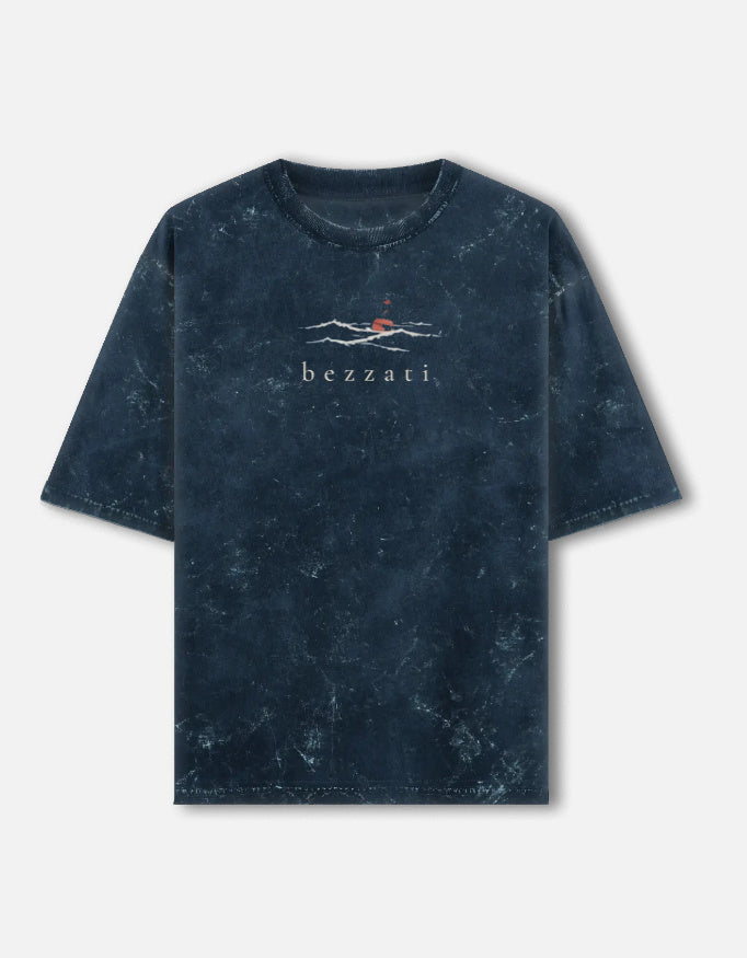 Front of the navy acid-wash Open Waters oversized t-shirt, with a small sun-over-water mark above the bezzati wordmark