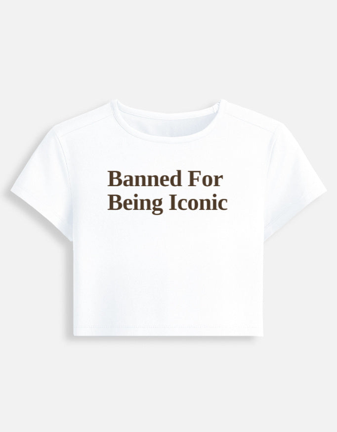 Front of the Banned cropped baby tee in White: Banned For Being Iconic in dark-brown serif