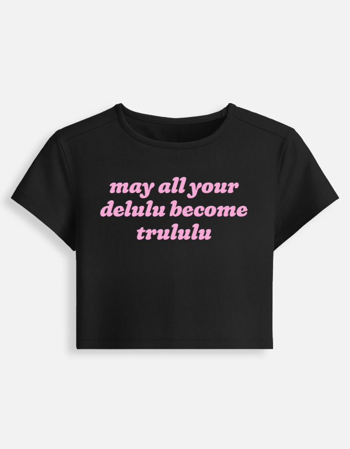 Front of the black Delulu Become Trululu cropped baby tee: may all your delulu become trululu in pink rounded italic