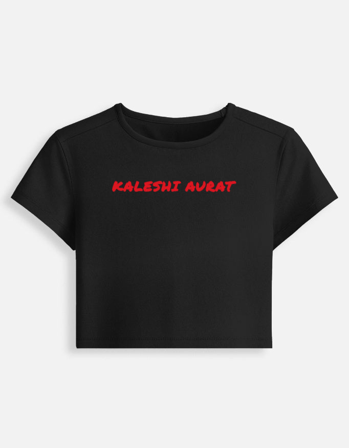 Front of the black Kaleshi Aurat cropped baby tee: Kaleshi aurat in red brush capitals