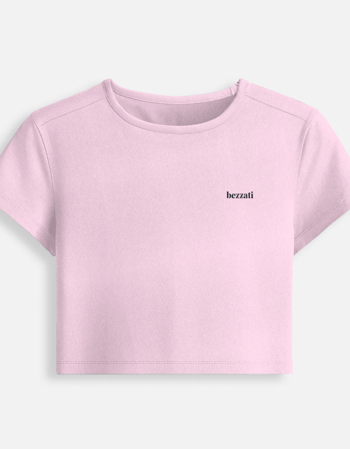 Front of the light baby pink Pehle Regret Phir Cigarette cropped baby tee, plain with a small bezzati wordmark on the chest
