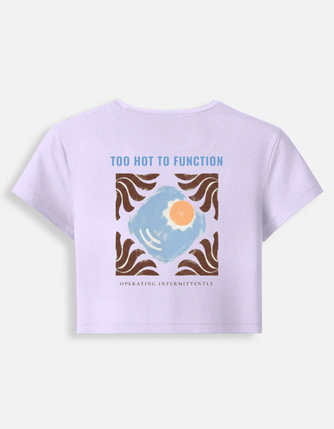 Too Hot To Function baby tee in lavender, back print of a sun set in a tiled square with a wave border