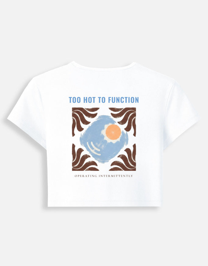 Too Hot To Function baby tee in white, back print of a sun in a tiled square above the words operating intermittently
